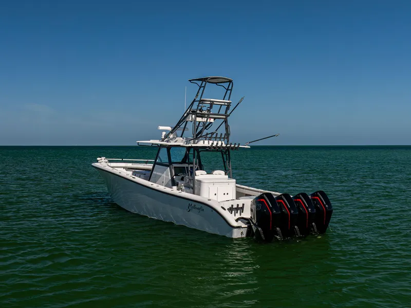 Slide: The Image of 2023 Yellowfin 39 Offshore boat with multiple engines on calm sea. - 3