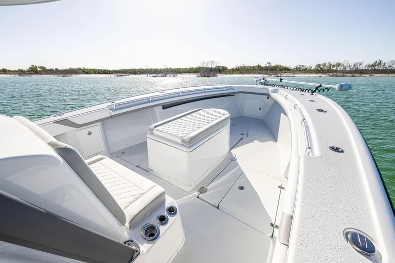 Slide: The Image of 2023 Yellowfin 39 Offshore boat interior with seating, on calm water. - 32