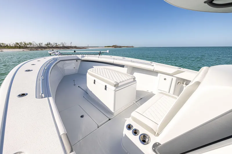 Slide: The Image of 2023 Yellowfin 39 Offshore boat interior with seating, ocean view, and clear sky. - 33