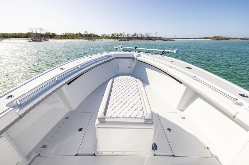 Slide: The Image of 2023 Yellowfin 39 Offshore boat, spacious deck, calm waters, clear sky, scenic view. - 34