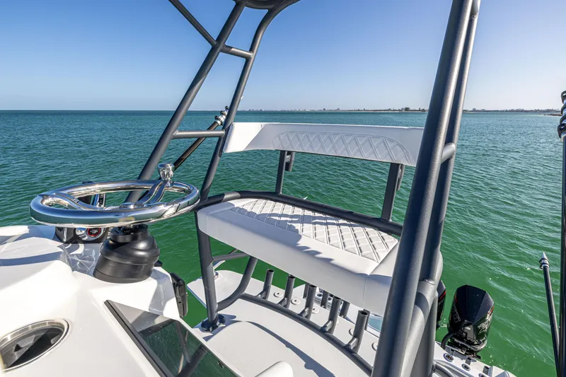 Slide: The Image of 2023 Yellowfin 39 Offshore boat helm with ocean view, featuring sleek design and modern controls. - 39