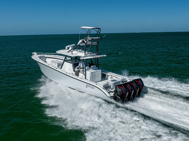 Slide: The Image of 2023 Yellowfin 39 Offshore boat cruising on open water with powerful engines. - 7