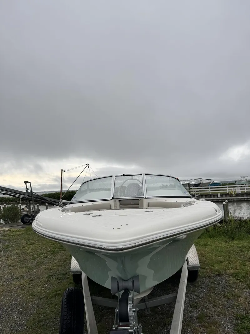 Slide: The Image of 2021 Key West 203 DFS boat on trailer under cloudy sky. - 3
