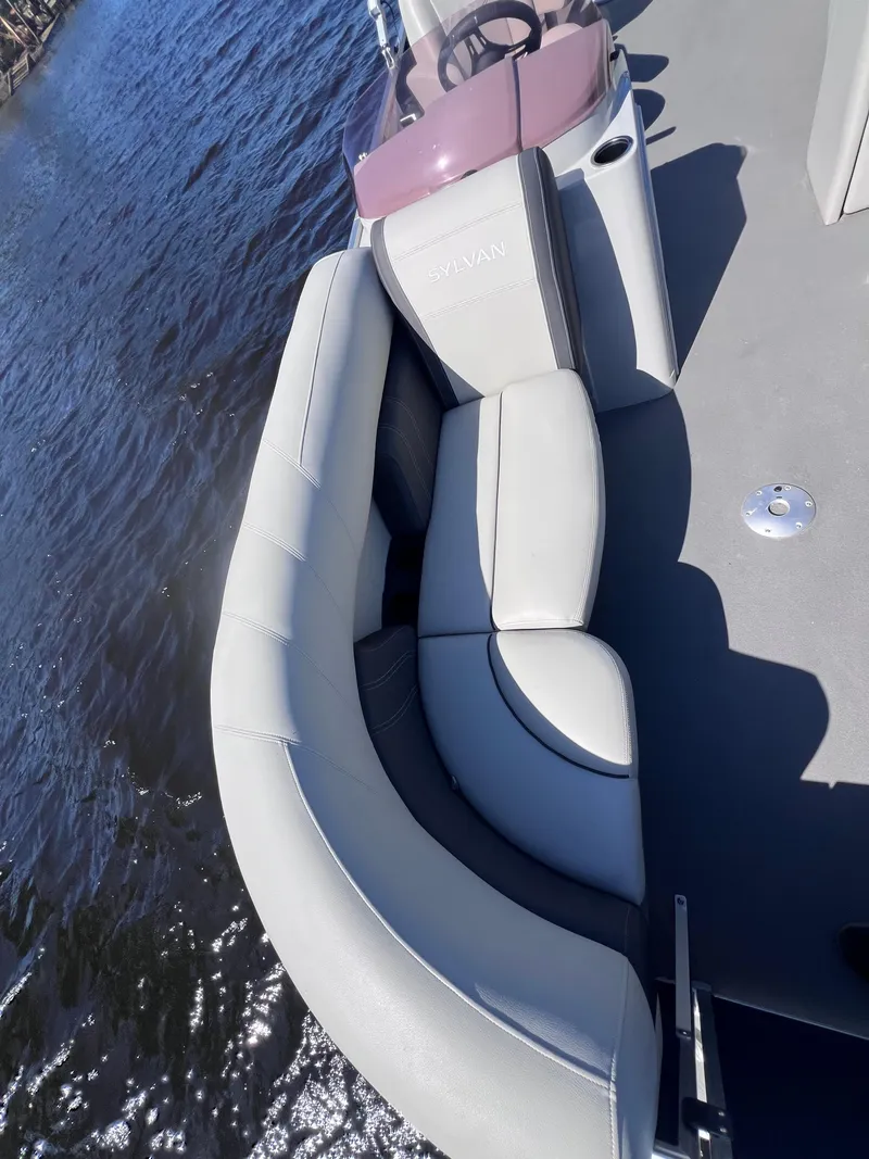 Slide: The Image of 2022 Sylvan Mirage 820 PARTY FISH boat with comfortable seating on a sunny day. - 12