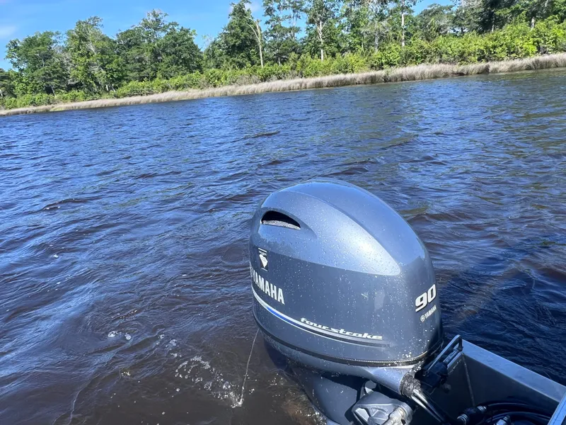 Slide: The Image of 2022 Sylvan Mirage 820 PARTY FISH with Yamaha outboard motor on a scenic lake. - 13