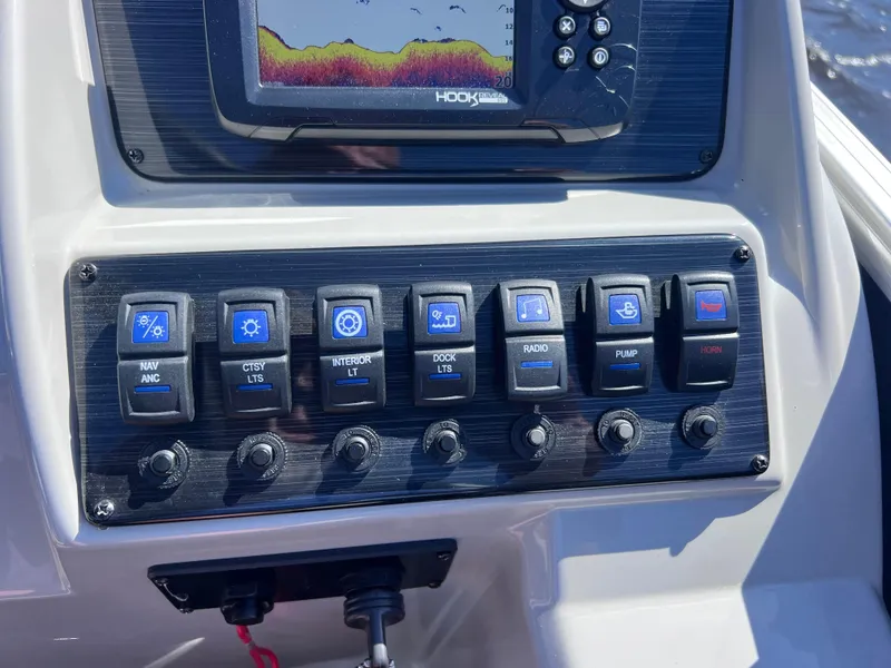 Slide: The Image of Control panel of 2022 Sylvan Mirage 820 PARTY FISH with switches and fish finder display. - 20