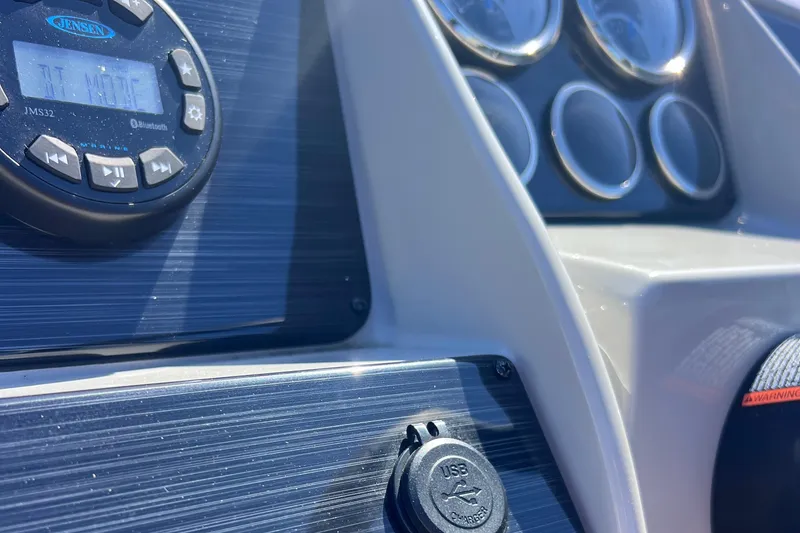 Slide: The Image of Dashboard of 2022 Sylvan Mirage 820 PARTY FISH with gauges and audio controls. - 23