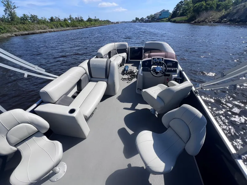Slide: The Image of 2022 Sylvan Mirage 820 PARTY FISH pontoon boat with spacious seating on a scenic waterway. - 8
