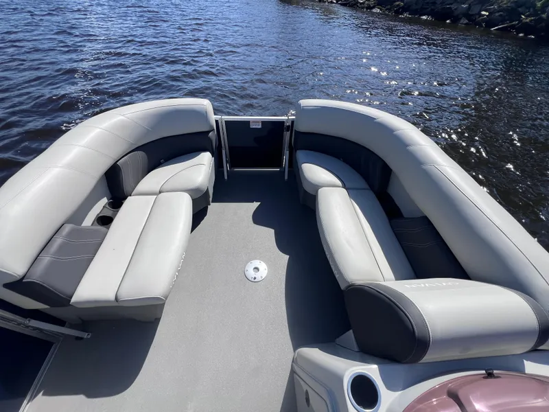 Slide: The Image of 2022 Sylvan Mirage 820 PARTY FISH pontoon boat with spacious seating on calm water. - 9