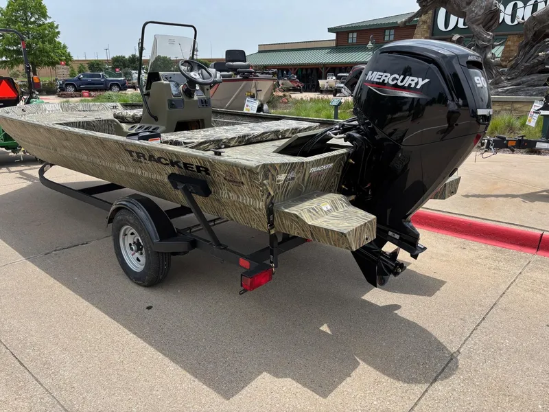 Slide: The Image of 2025 Tracker Grizzly 1860 CC boat with Mercury engine on trailer. - 2