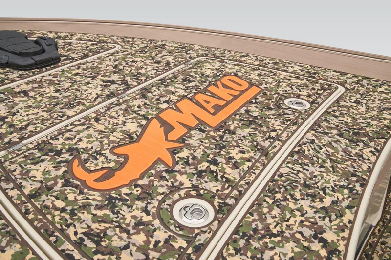 Slide: The Image of 2025 Mako 18 Pro Skiff Backwater Edition boat with sleek deck design. - 12