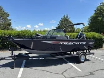 Slide: The Image of 2025 Tracker Pro Guide V-175 Combo boat on trailer in parking lot. - 3