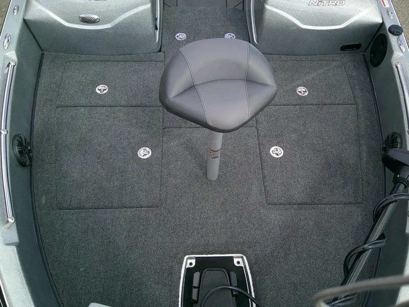 Slide: The Image of 2025 Nitro ZV19 Sport Pro boat interior with gray seating and carpeted flooring. - 7