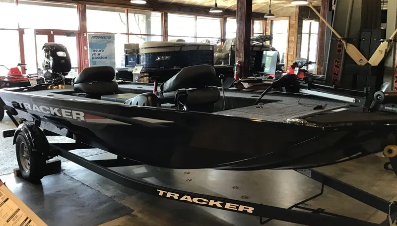 The Image of 2025 Tracker Panfish 17 boat displayed indoors on a trailer. - 0