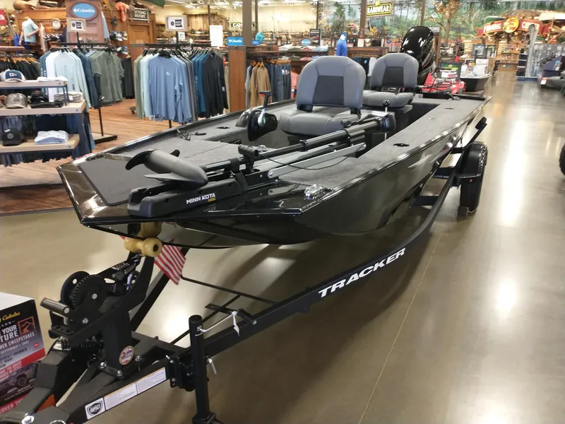 The Image of 2025 Tracker Panfish 17 boat displayed in a store, featuring Minn Kota trolling motor. - 0