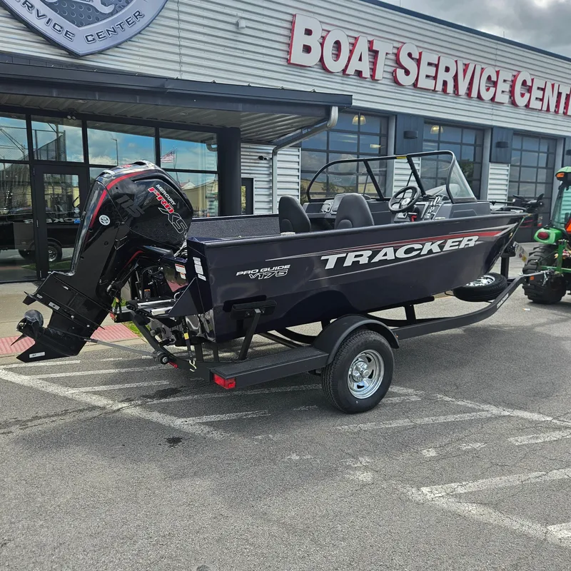 Slide: The Image of 2025 Tracker Pro Guide V-175 Combo boat at service center, on trailer. - 3