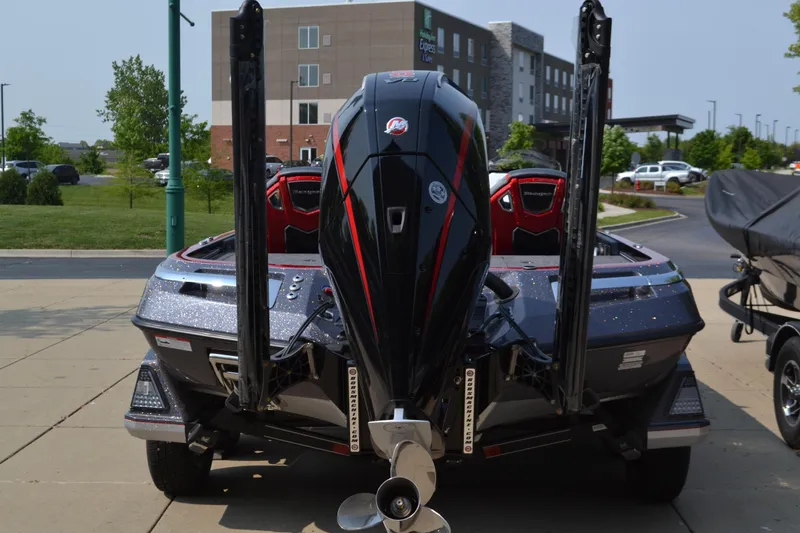 Slide: The Image of 2025 Ranger Z521R Cup-Equipped boat, rear view, parked outdoors. - 2
