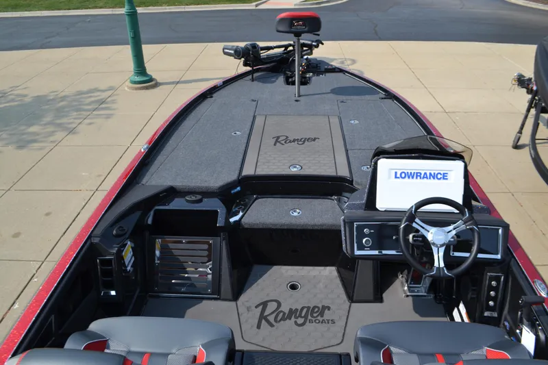 Slide: The Image of 2025 Ranger Z521R Cup-Equipped boat interior with Lowrance electronics and steering wheel. - 4