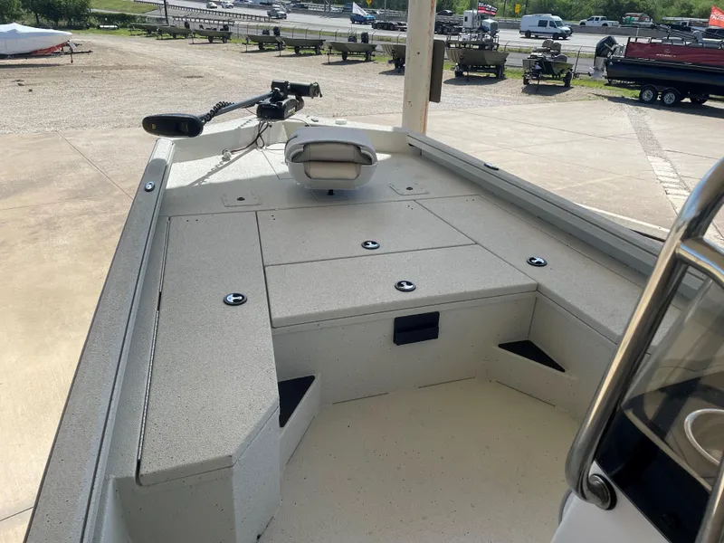 Slide: The Image of 2025 Ranger RB210 boat deck with storage compartments and trolling motor. - 11