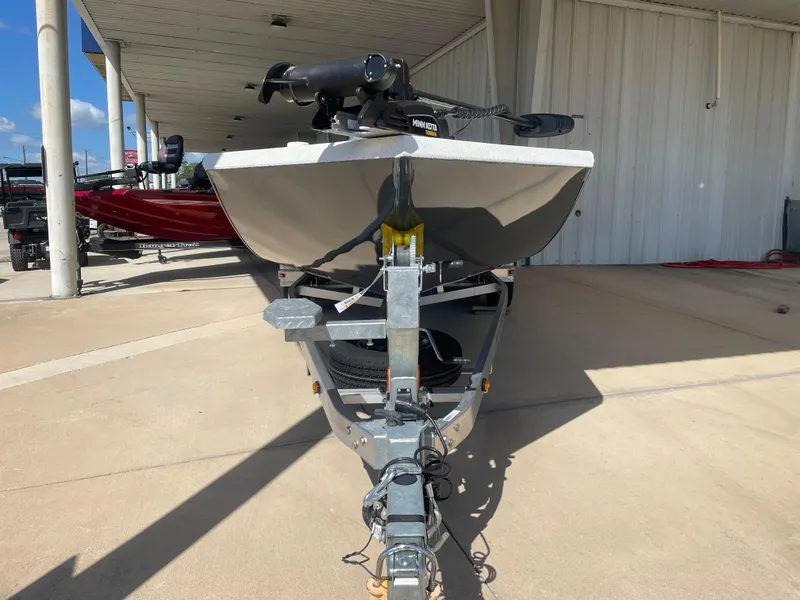 Slide: The Image of 2025 Ranger RB210 boat on trailer, parked outdoors, front view. - 2