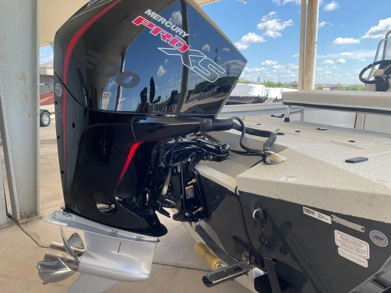 Slide: The Image of Mercury Pro XS outboard motor on 2025 Ranger RB210 boat, under clear blue sky. - 7