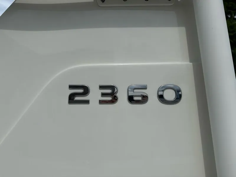 Slide: The Image of Close-up of 2025 Ranger 2360 Bay model emblem on boat exterior. - 2