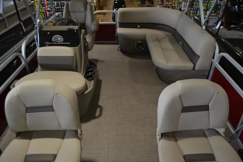 Slide: The Image of 2025 Sun Tracker Bass Buggy 16 XL Select interior with beige seating and spacious layout. - 3