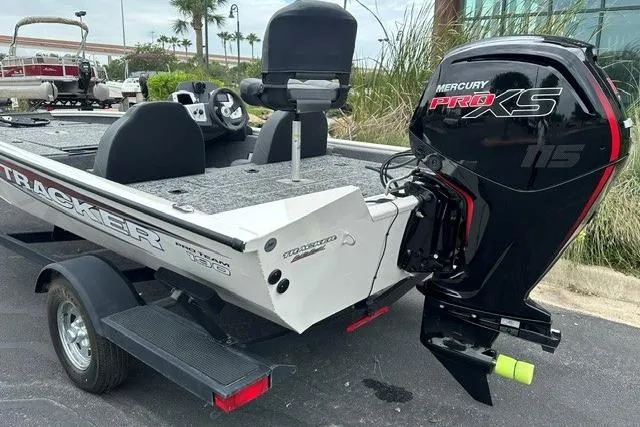 Slide: The Image of 2025 Tracker Pro Team 190 boat with Mercury Pro XS engine, parked outdoors. - 2