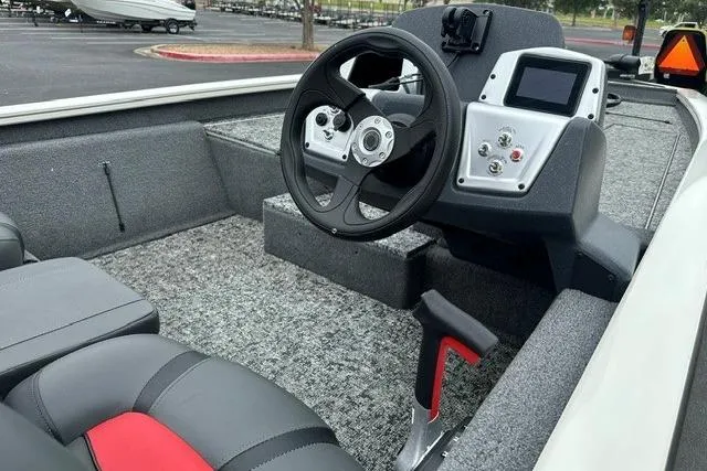 Slide: The Image of 2025 Tracker Pro Team 190 boat interior with steering wheel and control panel. - 6