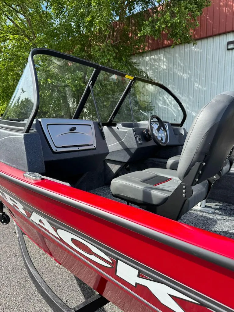 Slide: The Image of 2025 Tracker Pro Guide V-16 WT boat with sleek red design and modern cockpit. - 10