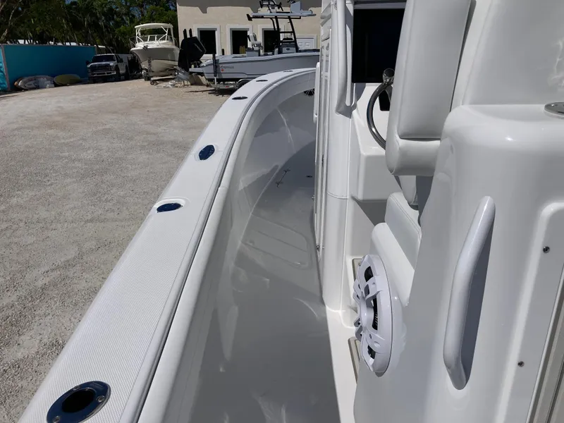 Slide: The Image of 2025 Bluewater II25T boat interior with sleek white design and modern features. - 12