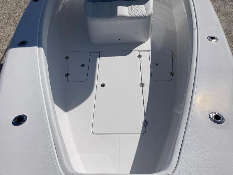 Slide: The Image of 2025 Bluewater II25T boat deck with storage compartments and seating area. - 18
