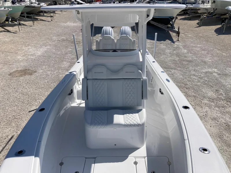 Slide: The Image of 2025 Bluewater II25T boat with sleek white interior and dual seating arrangement. - 19