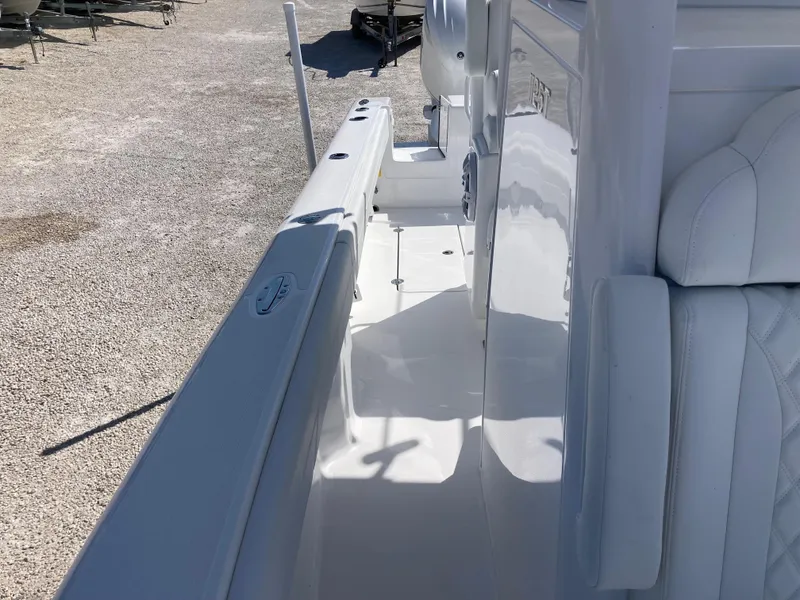 Slide: The Image of 2025 Bluewater II25T boat interior with sleek white seating and deck design. - 20