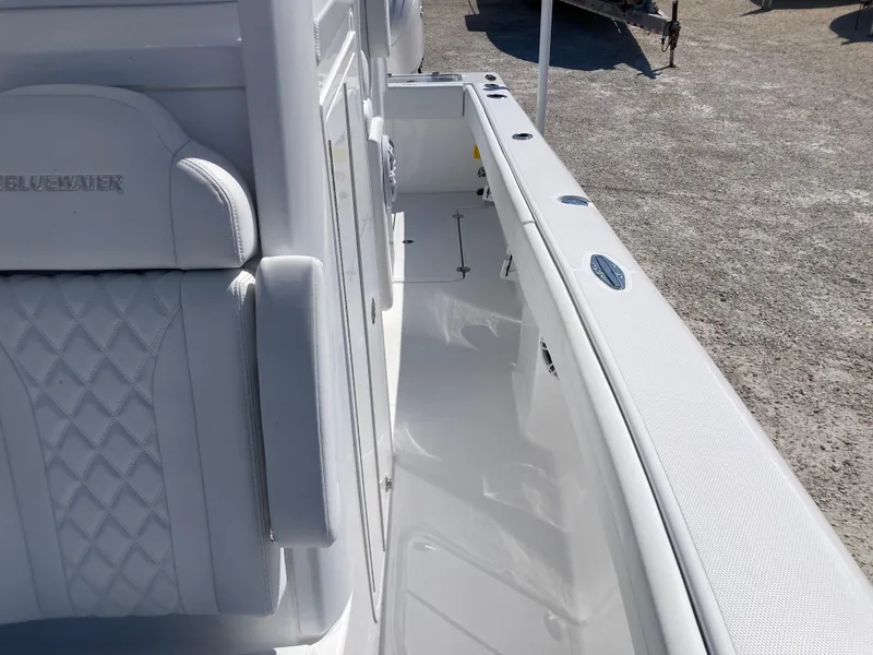 Slide: The Image of 2025 Bluewater II25T boat interior with white seating and sleek design. - 21