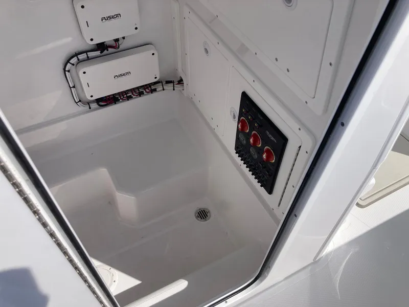 Slide: The Image of Interior view of 2025 Bluewater II25T boat showing electrical panel and wiring. - 23