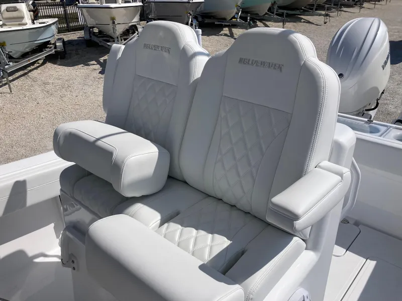 Slide: The Image of 2025 Bluewater II25T boat seats with quilted design and armrests. - 26
