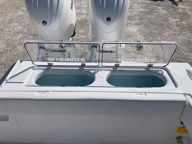Slide: The Image of 2025 Bluewater II25T boat with dual live wells and twin engines. - 31