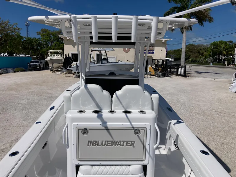 Slide: The Image of 2025 Bluewater II25T boat with sleek white design and spacious seating. - 7