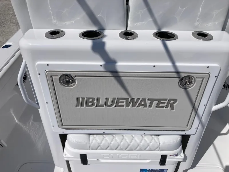 Slide: The Image of 2025 Bluewater II25T boat console with rod holders and Engel cooler. - 8