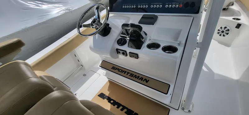 Slide: The Image of 2017 Sportsman Open 282 Center Console boat interior with steering wheel and control panel. - 20