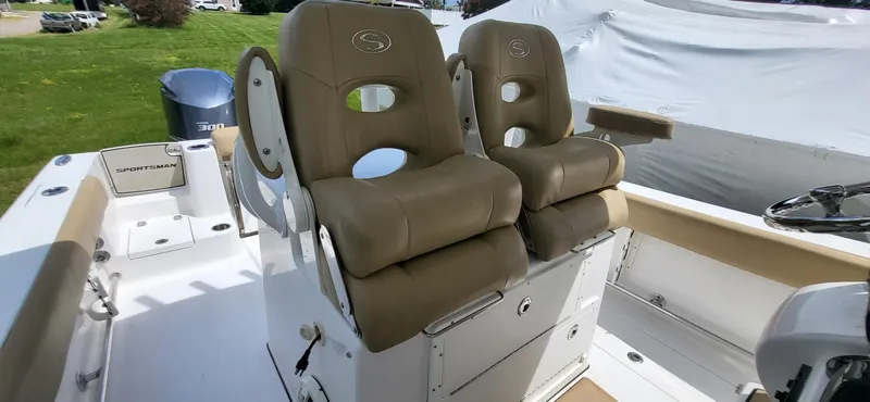 Slide: The Image of 2017 Sportsman Open 282 Center Console boat with tan cushioned seats. - 21