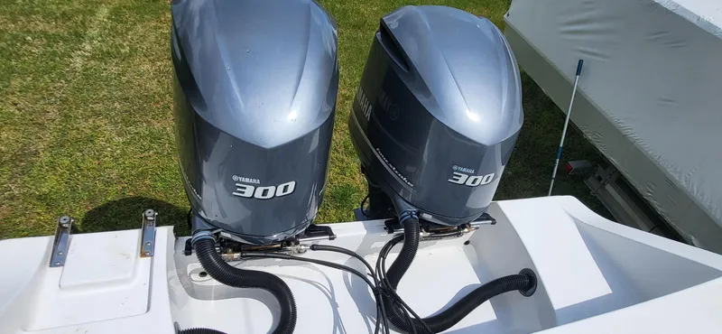 Slide: The Image of Twin Yamaha 300 engines on a 2017 Sportsman Open 282 Center Console boat. - 6