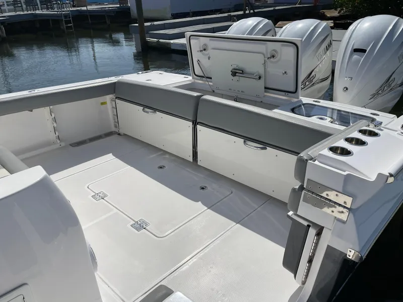 Slide: The Image of 2021 Everglades 395cc boat with spacious deck and powerful engines docked at marina. - 27