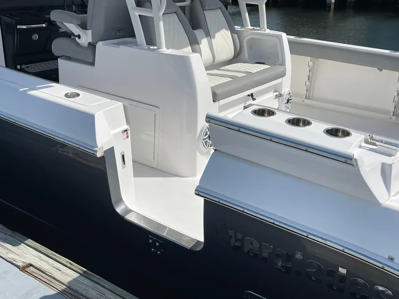 Slide: The Image of 2021 Everglades 395cc boat interior with seating and cup holders. - 30