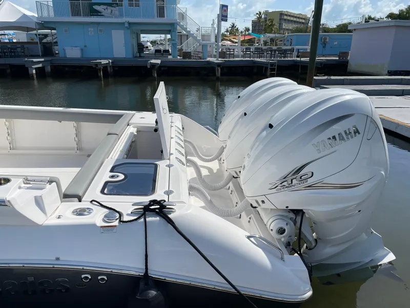 Slide: The Image of 2021 Everglades 395cc boat with twin Yamaha outboard engines docked at marina. - 31