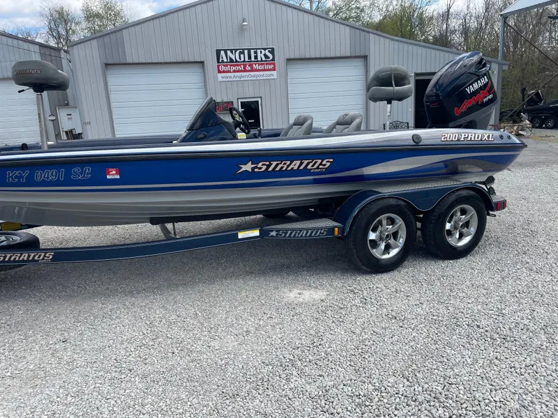 Slide: The Image of 2005 Stratos 200 ProXL boat with trailer, parked outside Anglers Outpost & Marine. - 2
