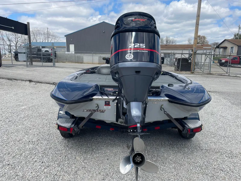 Slide: The Image of 2005 Stratos 200 ProXL boat with powerful 225 engine, rear view on gravel lot. - 6