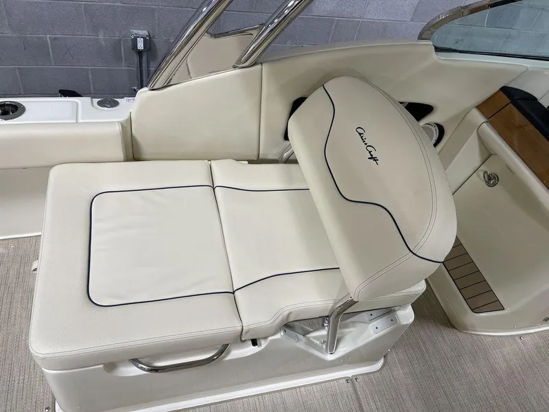 Slide: The Image of 2023 Chris-Craft 24 CALYPSO boat seat with cream upholstery and sleek design. - 14