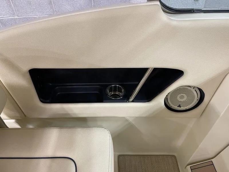 Slide: The Image of 2023 Chris-Craft 24 CALYPSO interior detail with cup holder and speaker. - 19